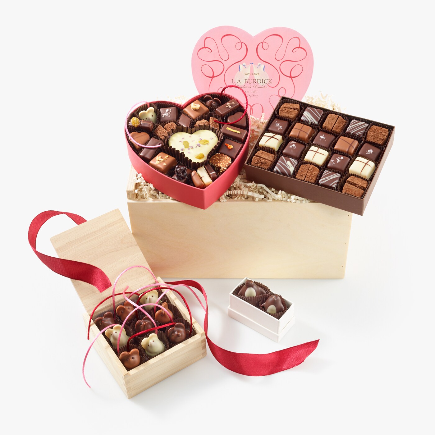 Wooden gift box filled with Valentine's Day assortment, Chocolate Caramels, Chocolate Mice, and Chocolate Penguins.